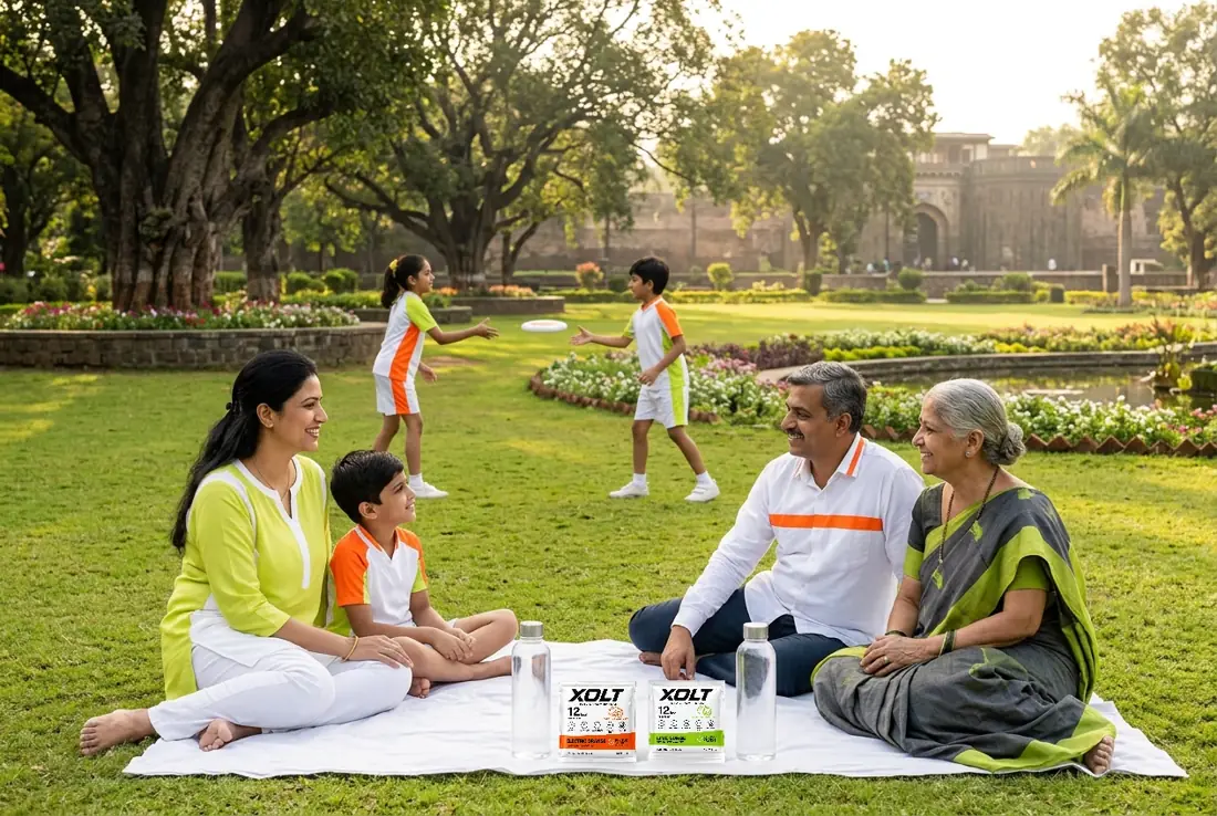 An Indian family enjoying a park picnic with XOLT sachets