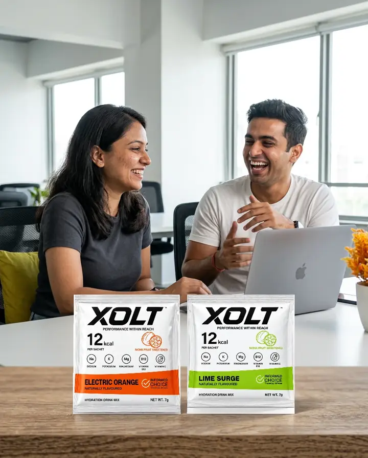 Indian colleagues taking a workday break with XOLT beside their laptop